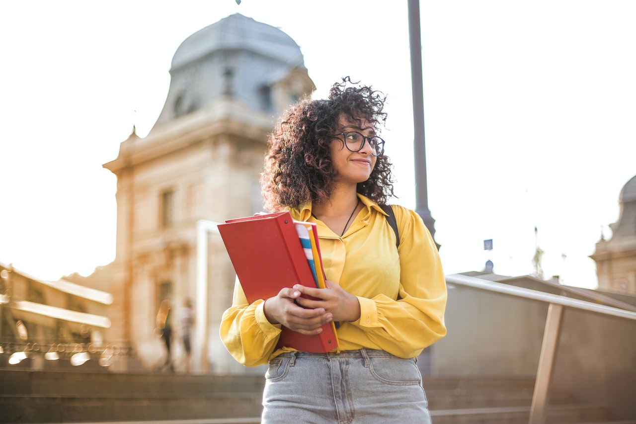 school woman holding books