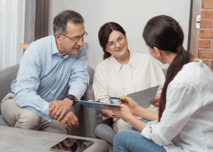 60 year old couple meeting with attorney to plan inheritence